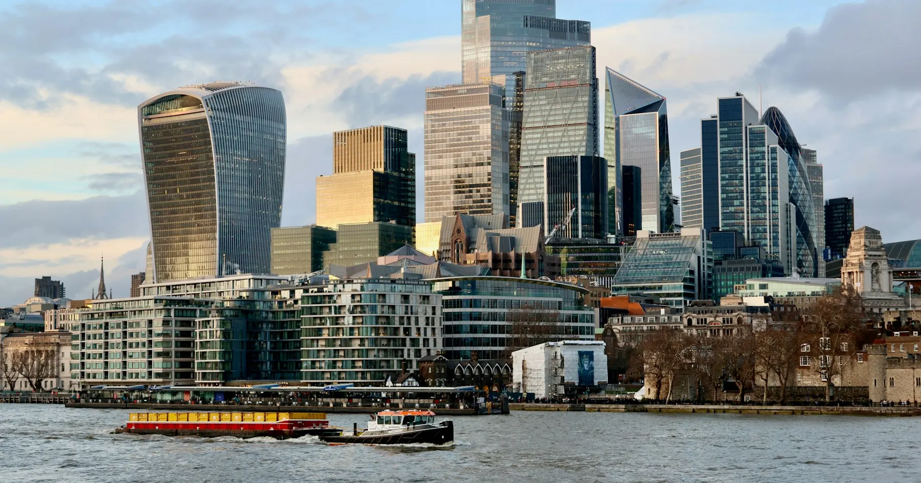 The City of London skyline and modern commercial buildings beside the River Thames