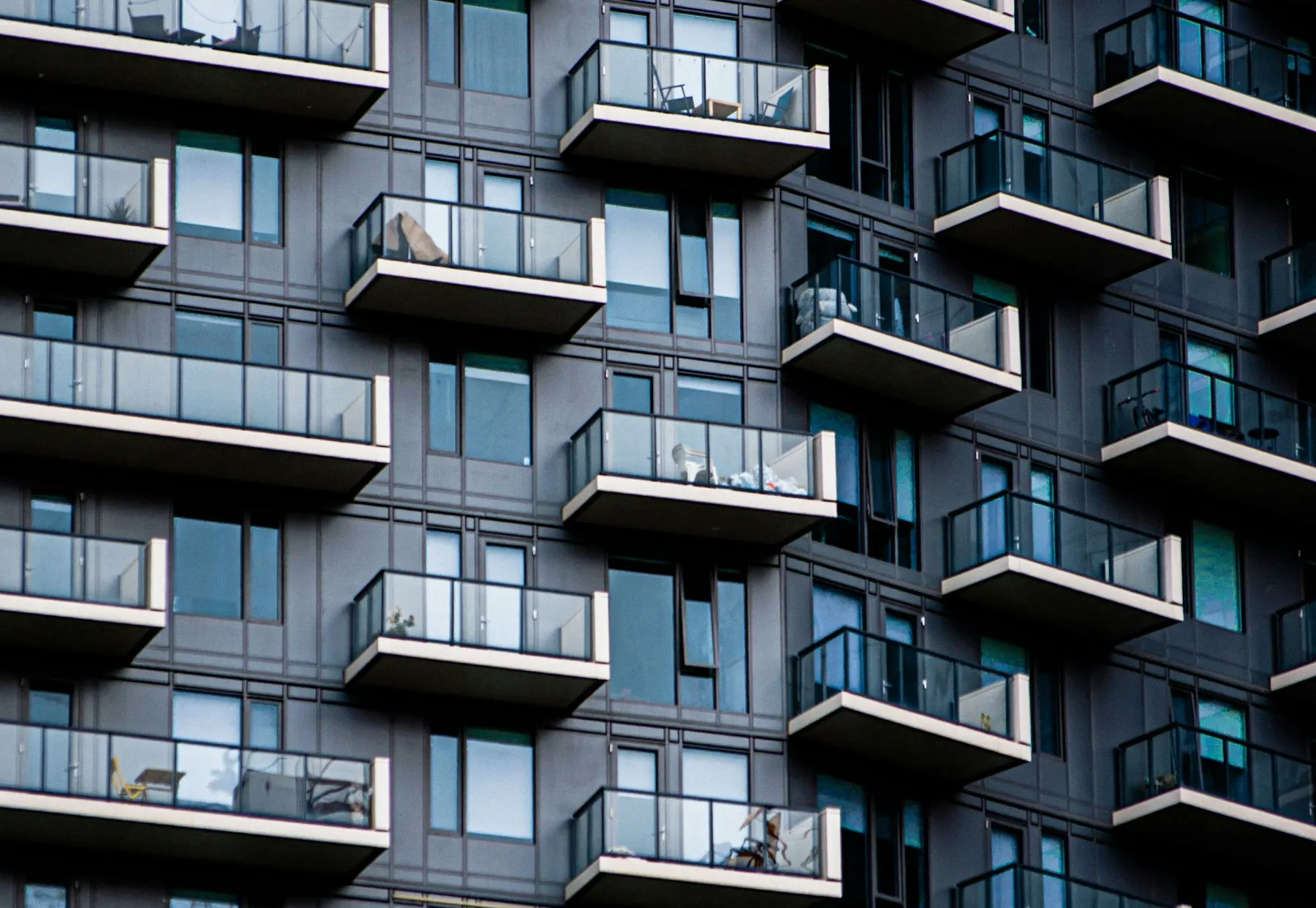 Contemporary residential apartment building with glass-fronted balconies