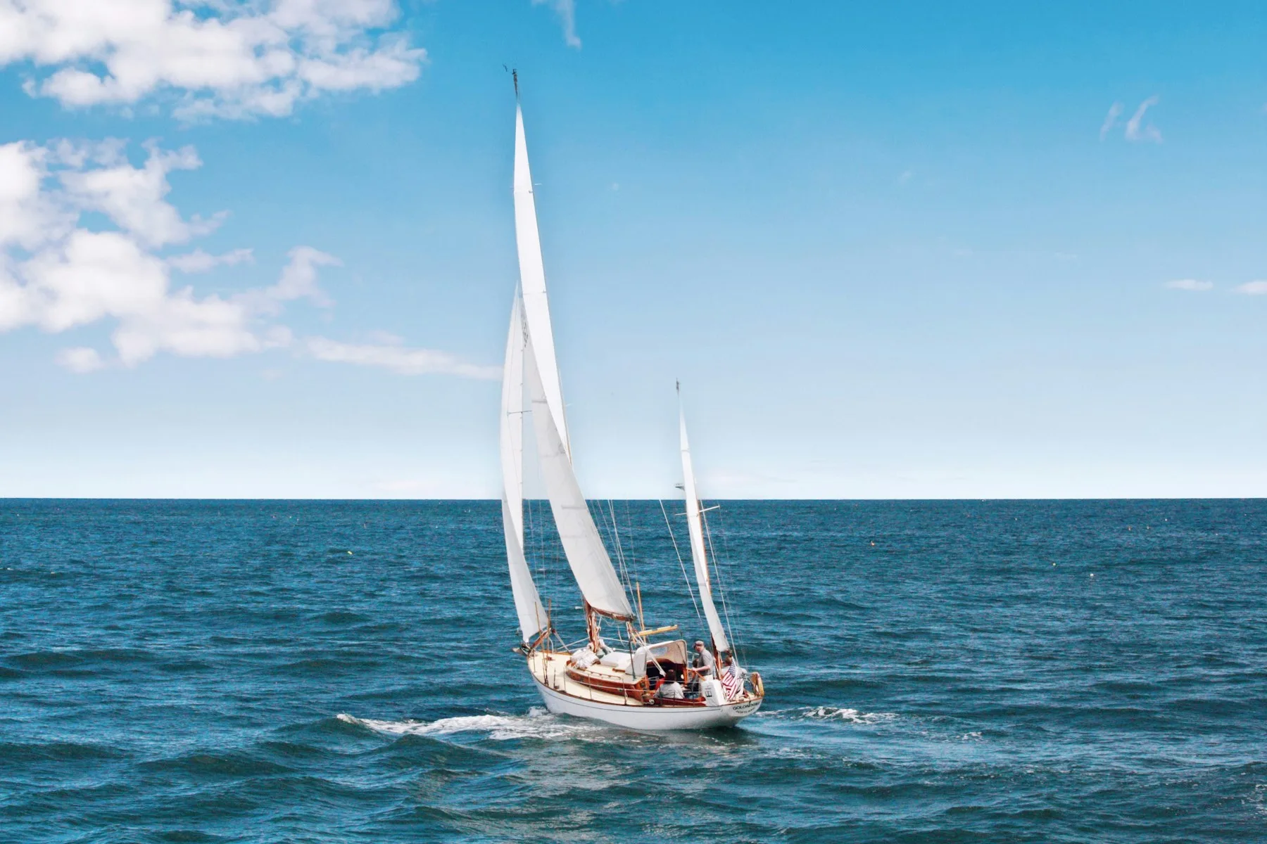 Sailing yacht on open blue water